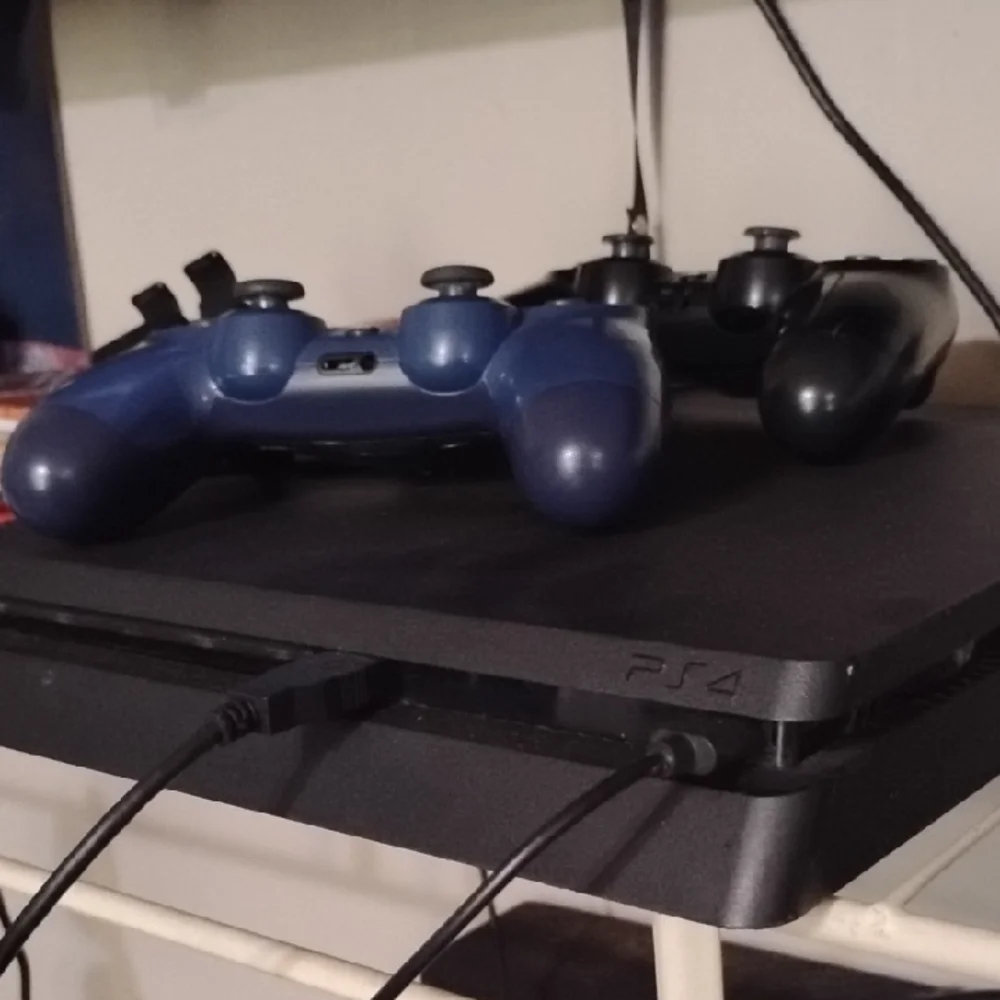 Sony PS4 Console with Black and Blue Controllers